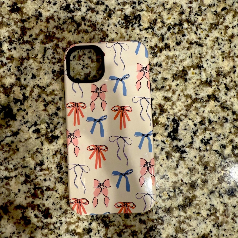 BLUE-AND-PINK BOWS iPhone 14 plus case. Used one week before getting new phone.
